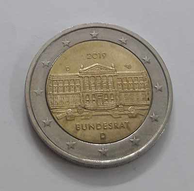 Commemorative two-euro coin and metal
